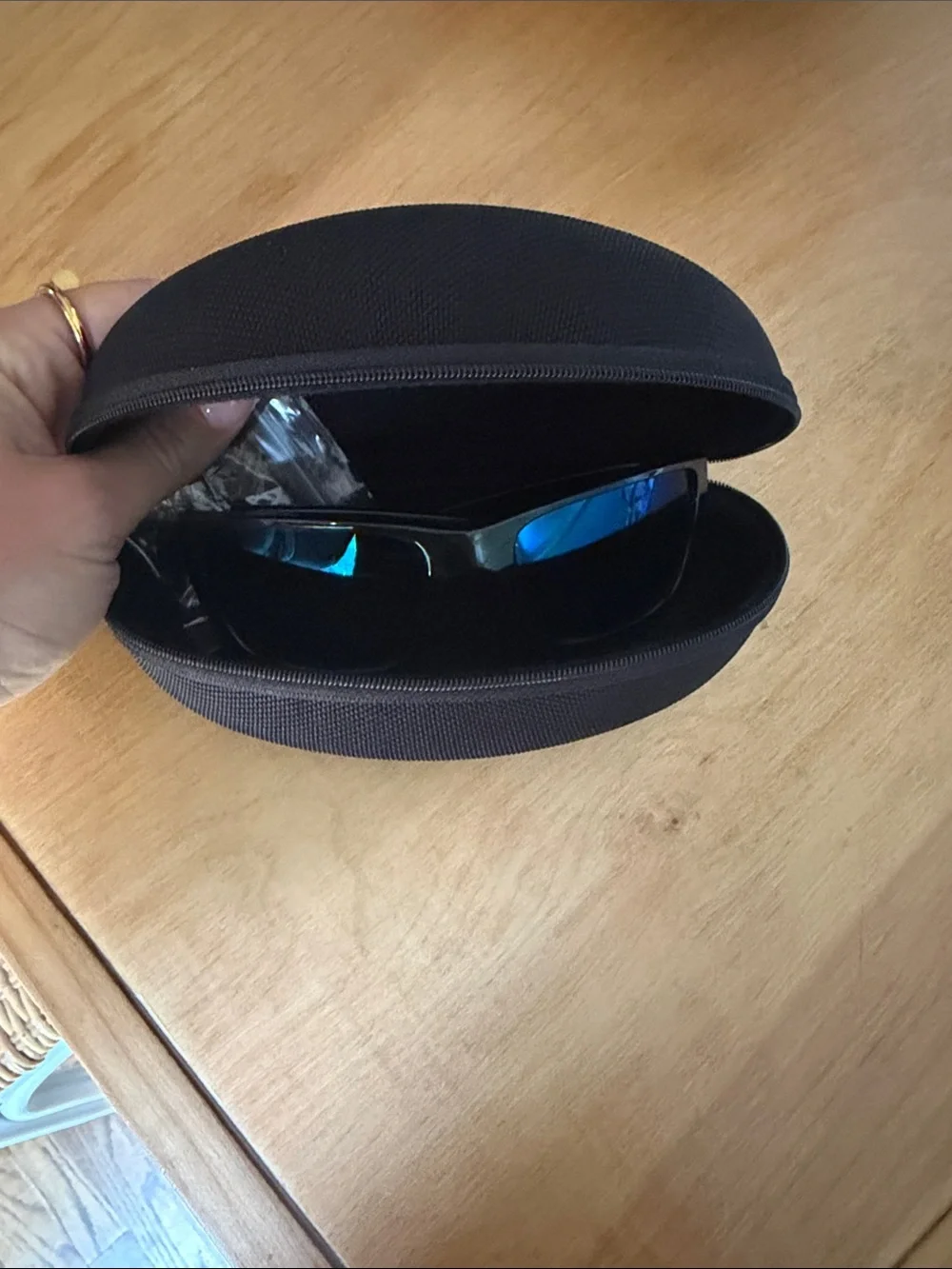 Oakley Black Frame Sunglasses with Blue Mirrored Lenses